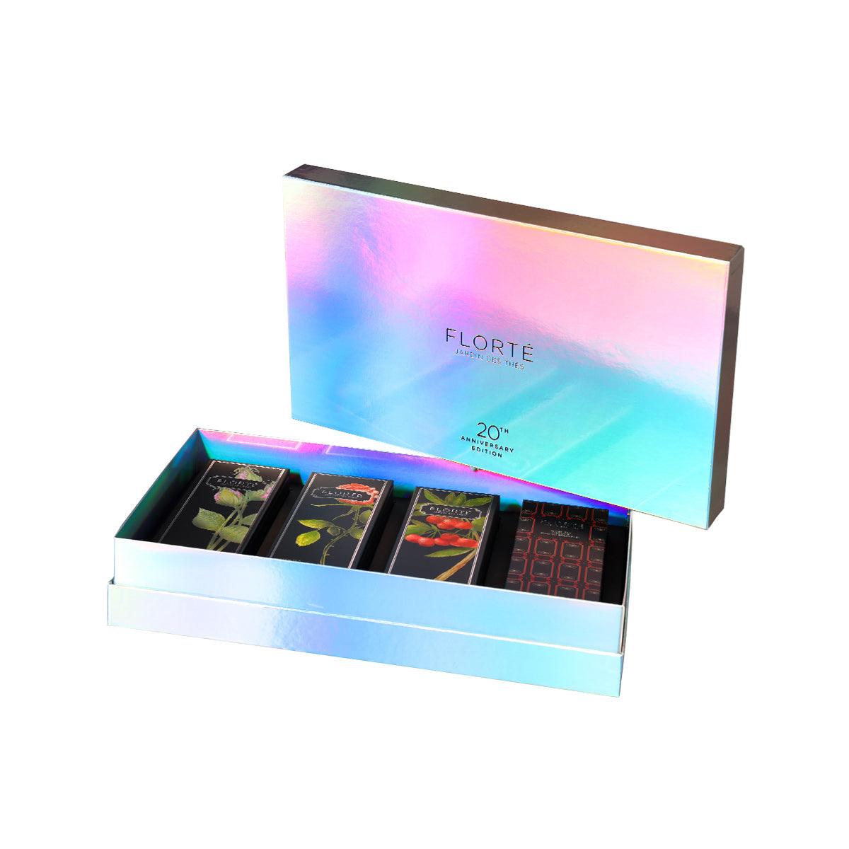 Iridescent tea gift set box with four FLORTE tea assortment packs inside