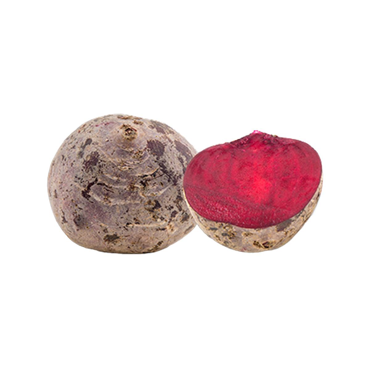 Fresh beetroot bulbs, one halved showing deep red flesh
