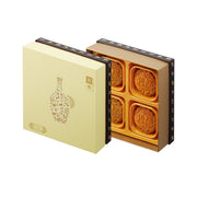 Pistachio mooncake gift box set with open gold compartments and illustrated inserts