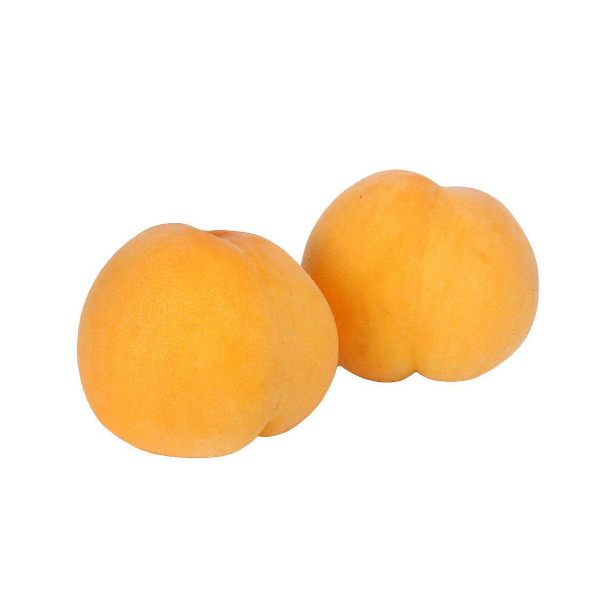 Golden peach fruits, two whole peaches