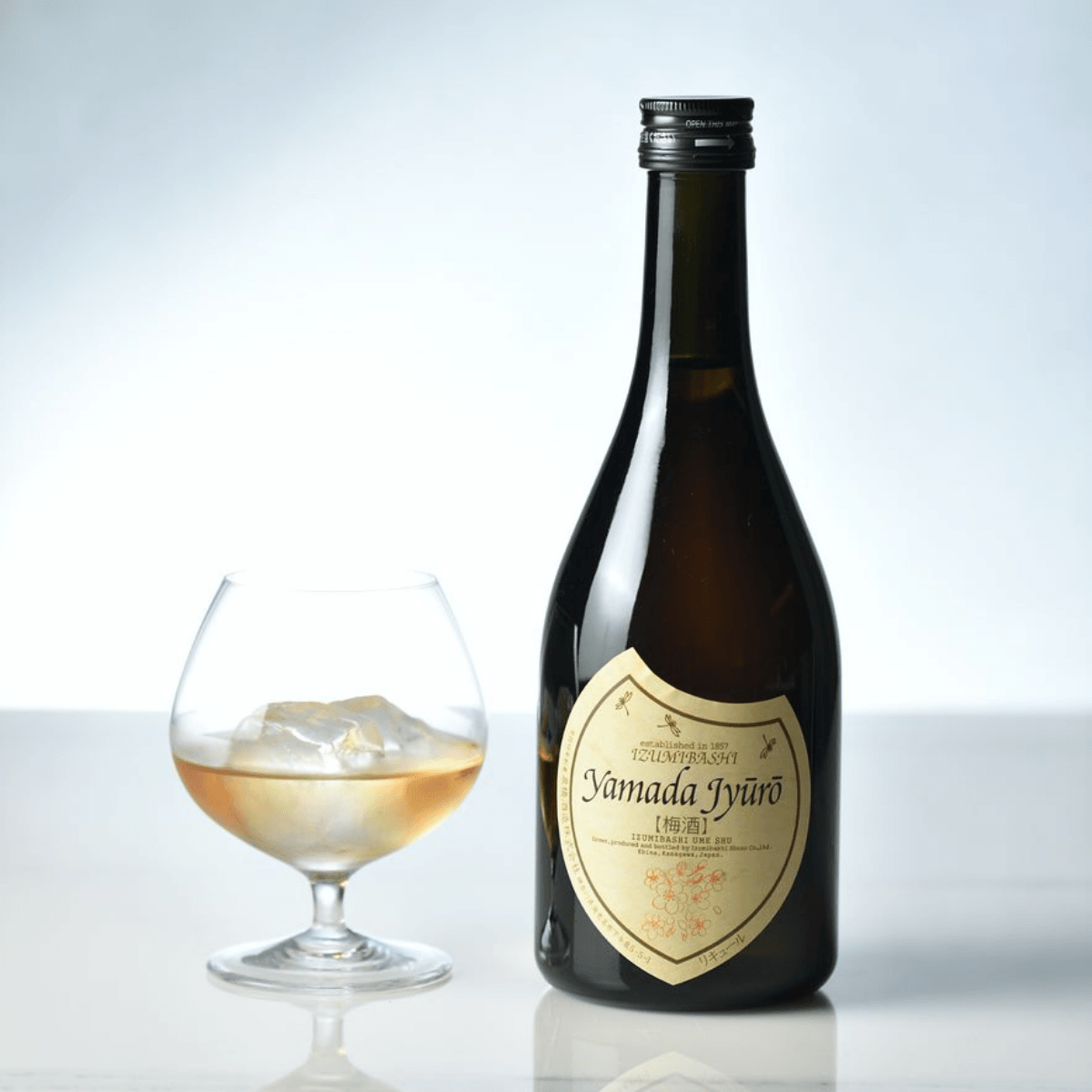 Umeshu bottle and short glass with pale amber drink, 500 mL