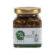 Glass jar of porcini and mushroom sauce with gold lid, front label