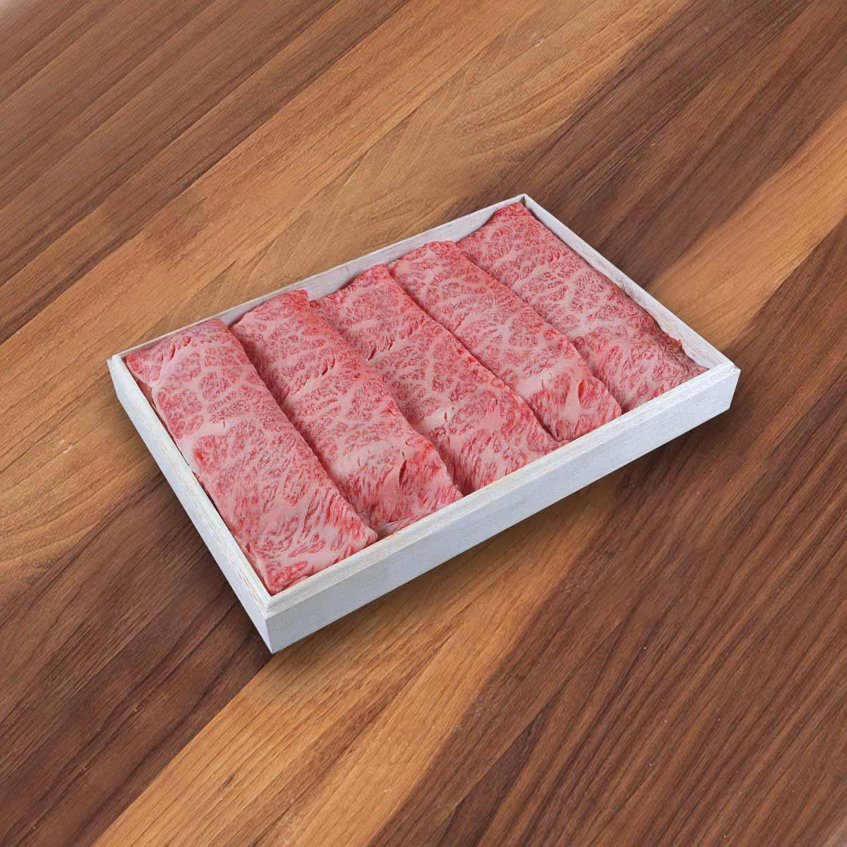 Matsusaka wagyu beef slices in white foam tray, marbled pink